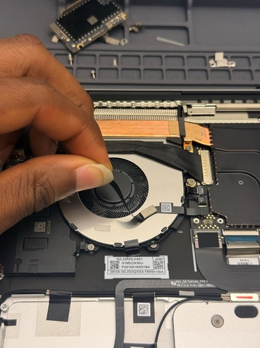 Screenshot that shows peeling the nSIM FPC from the fan and cleaning adhesive residue.