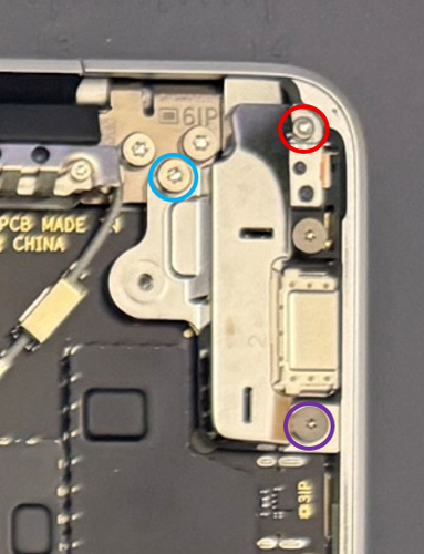 Screenshot that shows lifting the audio jack bridge out of the device after removing the bridge screws and hinge screw.