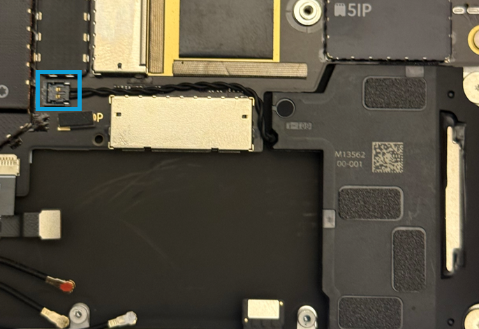 Screenshot that shows installing the Left Speaker and the connector being pressed into the motherboard receptacle.