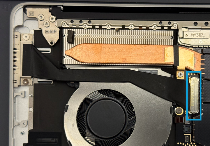 Screenshot that shows the Surface Connect connector and flipped-up latch on the motherboard.