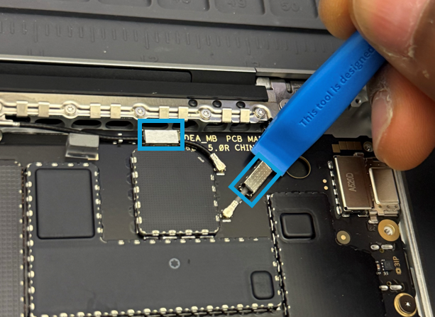 Screenshot that shows prying up the coax cable lids with a nylon spudger.
