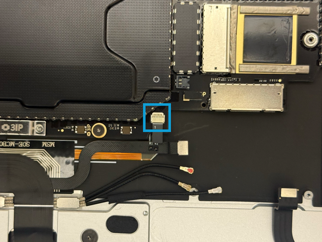 Screenshot that shows the keyboard backlight FPC removed from the motherboard connector after flipping the latch.