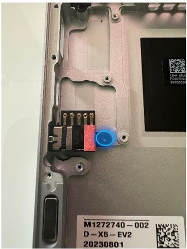 Screenshot that shows audio jack screw being removed from chassis (13-inch).