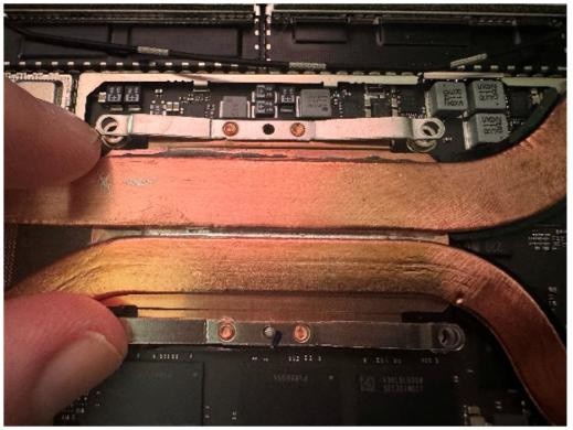 Screenshot that shows thermal module and fan assembly lowered into chassis with screw holes aligned.
