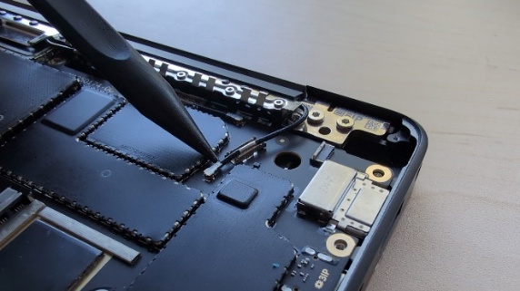 Screenshot that shows detaching two coax cables using a nylon spudger.